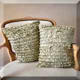 D75. Pair of ruffled green pillows. 
